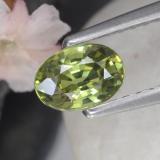 0.6 carat Golden Green Oval Facet Demantoid Garnet 6mm x 4mm