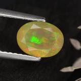 0.7 carat Multicolor Oval Facet Opal 8mm x 6