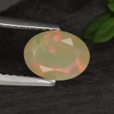 0.8 carat Multicolor Yellowish Green Oval Facet Opal 8mm x 6