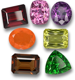 Pierres précieuses de couleur feu et bois : grenat pyrope, saphir rose, spinelle violet, opale de feu, quartz citron, grenat enstatite et tsavorite.