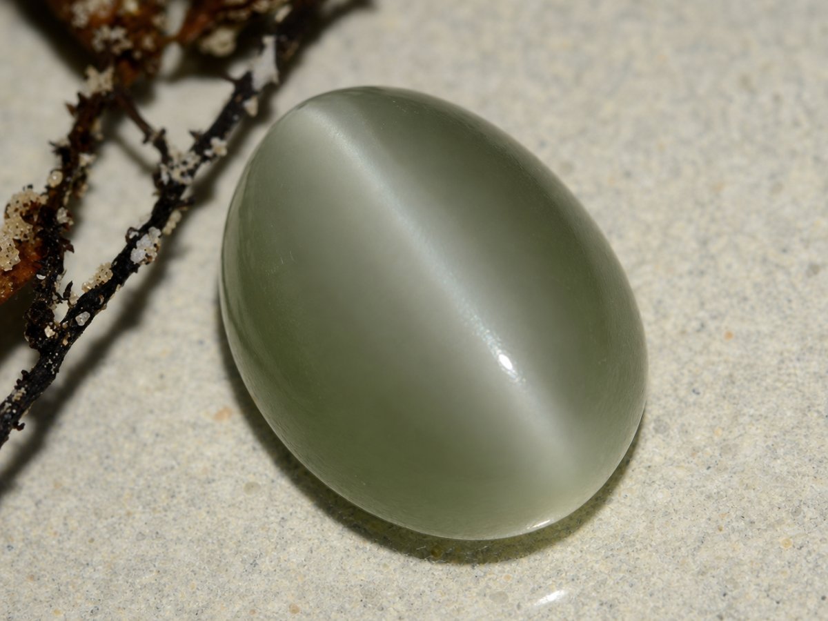 Close-up view of natural Actinolite Cat's Eye gemstones