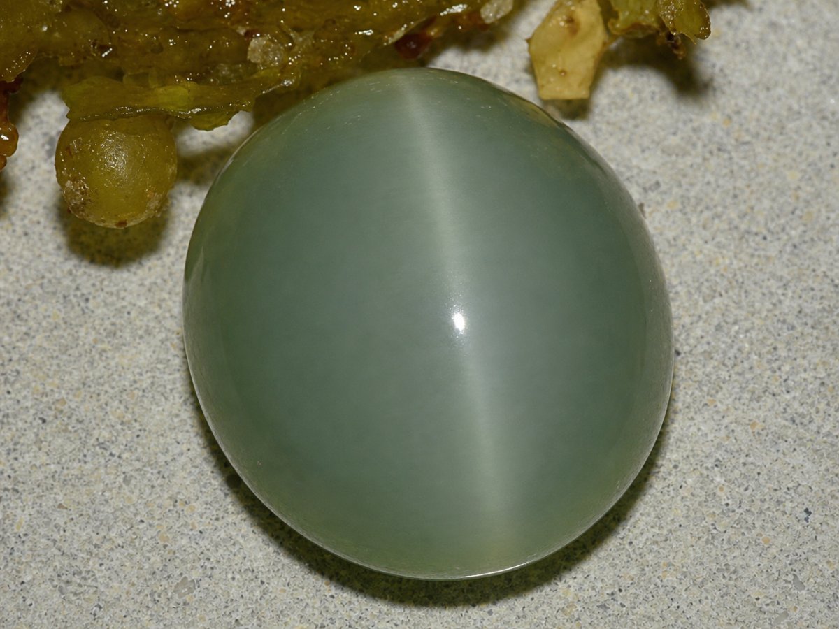 Close-up view of natural Actinolite Cat's Eye gemstones