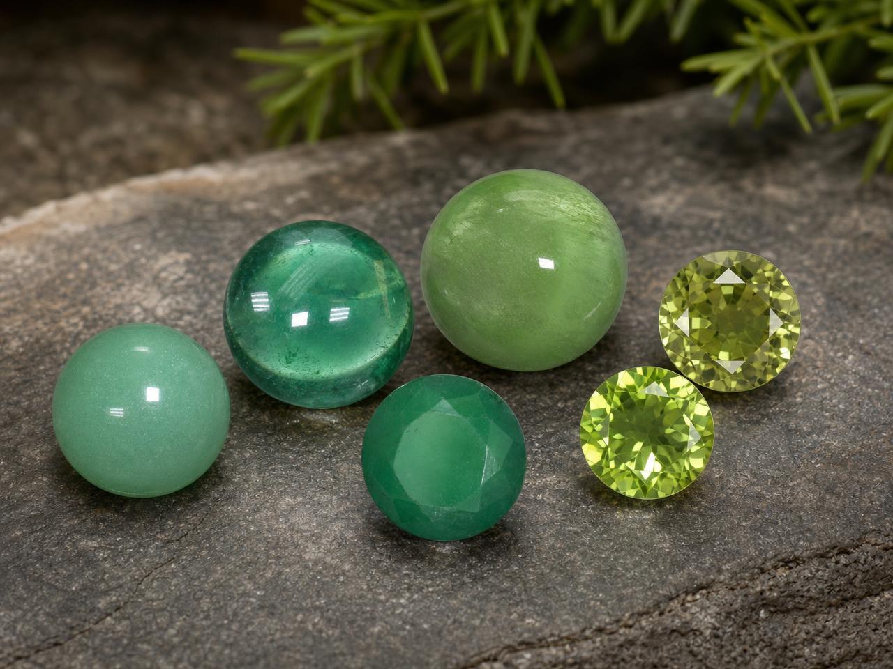 Loose round green gemstones in assorted shades