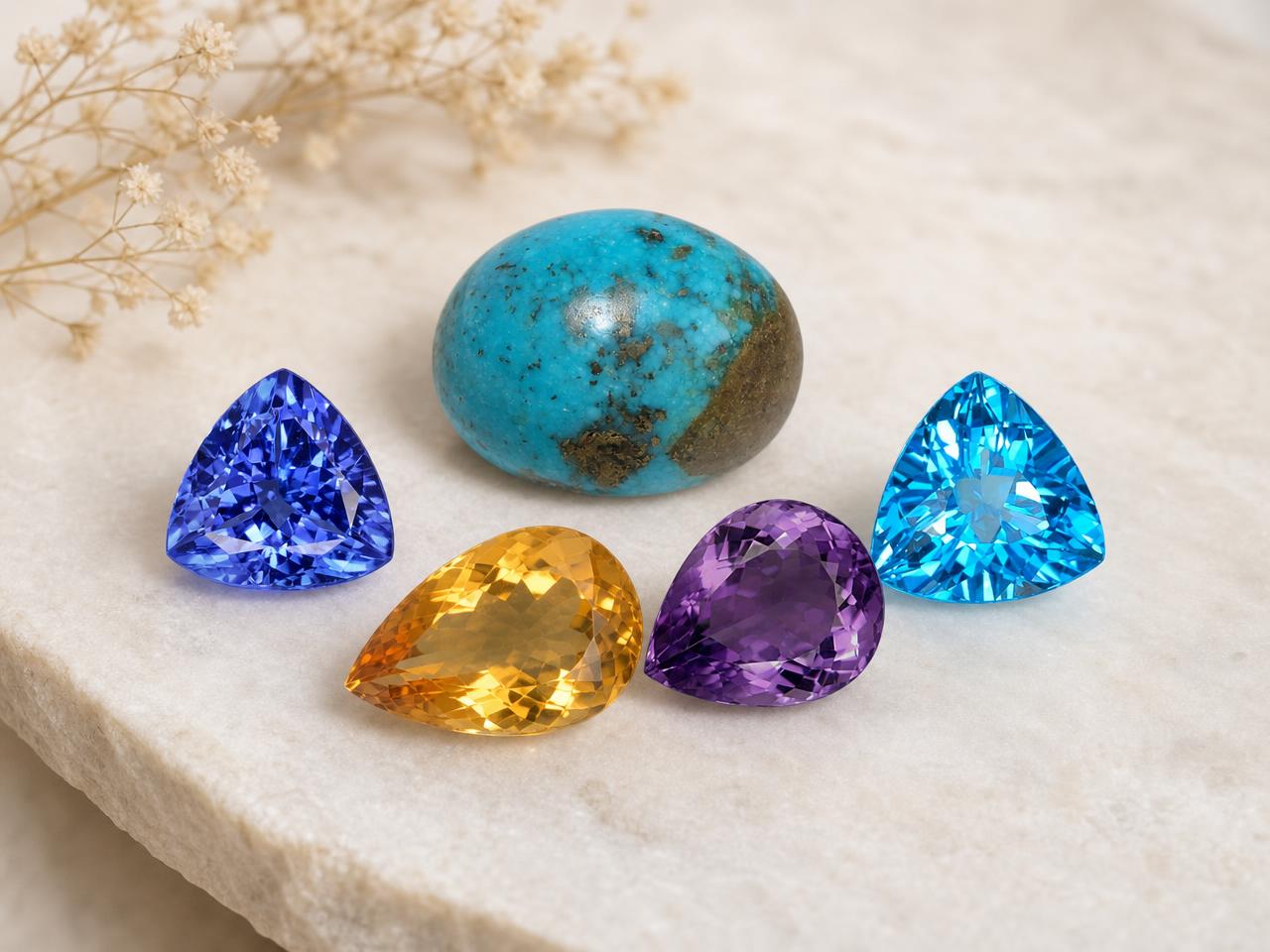 Loose Sagittarius birthstones in blue, turquoise and golden colors