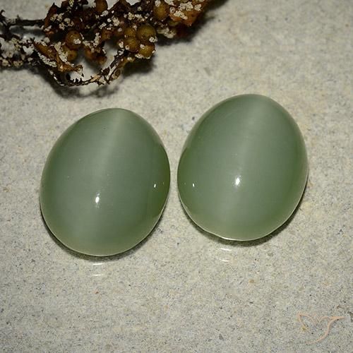 2pc Matching Oval Green Actinolite Cat's Eyes in Size 13.2 x 11.1mm, Weight 12.17ct total / avg. 6.09ct each, Medium Light-green in Translucent Clarity, Natural untreated Gemstone, Mohs Hardness 5.5 - 6, Photo A