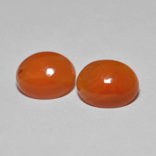 Ágata Ovalada a juego de 2 piezas en tamaño 8,7 x 7mm, peso 3,46 ct en total / promedio. 1,73 ct cada uno, Rojo fuego en claridad Transparente, piedra preciosa natural , dureza de Mohs 6.5 - 7 Adecuado para joyas de uso diario, Photo A
