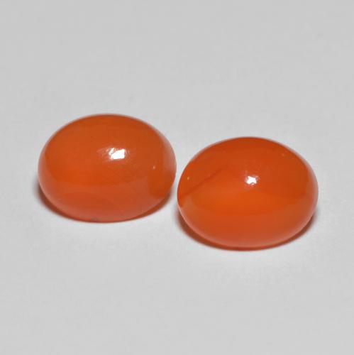 2 piezas de Ágata Naranja Ovalada a juego en tamaño 8,7 x 6,9mm, peso 3,47 ct en total / promedio. 1,74 ct cada uno, Naranja rojizo oscuro en claridad Transparente, piedra preciosa natural , dureza de Mohs 6.5 - 7 Adecuado para joyas de uso diario, Photo A