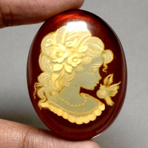 31.01 ct Orange Amber Gemstone, Amber Gem in Carved Cameo Shape for Sale.