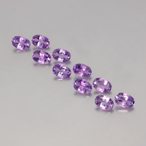 Lote de 10 piezas de Brasil Violeta Ovalada de Brasil - Tamaño 5,9 x 4,1mm, peso 3,91 ct en total / promedio. 0,39 ct cada uno, Color: Violeta púrpura medio, Dureza de Mohs 7 Adecuado para joyas de uso diario, Piedra natal de febrero, Photo A