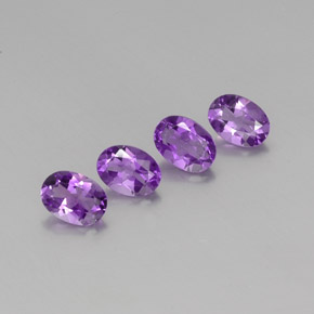 4-teiliges Set ovaler violetter Amethyst aus Brasilien - Gewicht 2,78 ct gesamt / Durchschn. je 0,7ct, Größe 7 x 5,1mm, Farbe: Mittelrosa Violett, Mohs-Härte 7 Geeignet für den täglichen Gebrauch im Schmuck, Entsperrt das Kronenchakra, Photo A