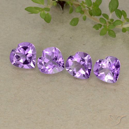 4pc Heart Violet Amethyst Lot from Brazil - Weight 2.43ct total / avg. 0.61ct each, Size 5.9 x 5.9mm, Color: Deep Purplish Violet, Mohs Hardness 7 suitable for daily wear jewelry, Symbolizes Calming and Soothing, Photo A