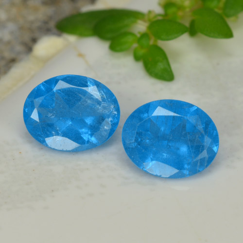 2pc Matching Oval Blue Apatites in Size 5.2 x 4.2mm, Weight 0.74ct total / avg. 0.37ct each, Intense Blue in VS-SI Clarity, Natural Gemstone, Mohs Hardness 5 - 5, Photo A