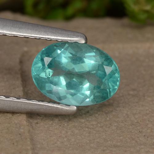 Apatita Verde azul intenso Ovalada de 0.88 ct de Madagascar, dimensión 6,9 x 4,9mm, piedra preciosa natural Caliente, claridad VS, Apatita Forma ovalada de 1 pieza, dureza de Mohs de 5 - 5 , Photo A