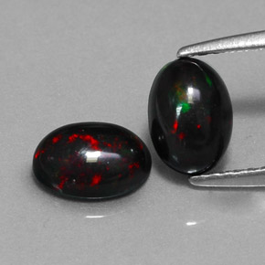 0.98 ct Multicolor Black Opal Gemstone, Black Opal Gem in Oval Cabochon Shape for Sale.