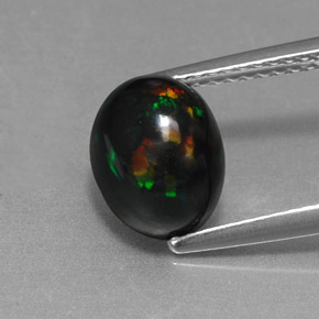 1.58 ct Multicolor Black Opal Gemstone, Black Opal Gem in Oval Cabochon Shape for Sale.