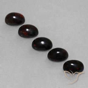 Lotto di 5 pezzi Opale nera multicolore taglio ovale dall'Etiopia - dimensioni 7 x 5mm, peso totale 2,67 ct / media. 0,53 ct ciascuno, colore: Multicolore, durezza Mohs 5,5 - 6,5, Photo A
