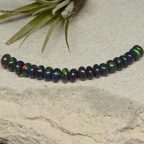 Lot of 20pc Rondelle Multicolor Black Opal from Ethiopia - Size 4.5 x 4.4mm, Weight 4.26ct total / avg. 0.21ct each, Color: Multicolor, Mohs Hardness 5.5 - 6.5, Photo A