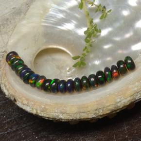 0.2ct Rondelle Multicolor Black Opal Gem for sale 0.2ct Rondelle Multicolor Black Opal Gem (ID: 482314)