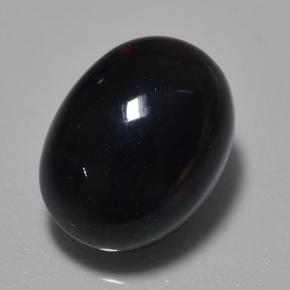 0.7ct Oval Cabochon Multicolor Black Opal Gem for sale 0.7ct Oval Cabochon Multicolor Black Opal Gem (ID: 500356)