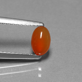 0.49 ct Orange Carnelian Gemstone, Carnelian Gem in Oval Cabochon Shape for Sale.