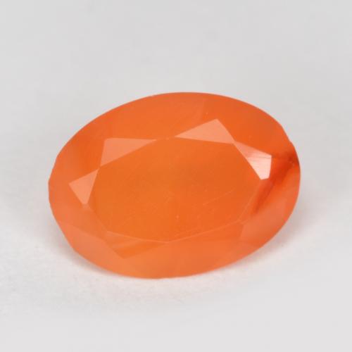 Orange abricot chaud Cornaline gemme - 0.6ct Ovale facette (ID: 556619)
