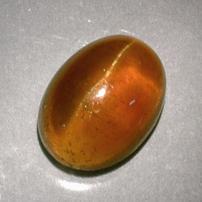 3.04 ct Orange Cat's Eye Apatite Gemstone, Cat's Eye Apatite Gem in Oval Cabochon Shape for Sale.