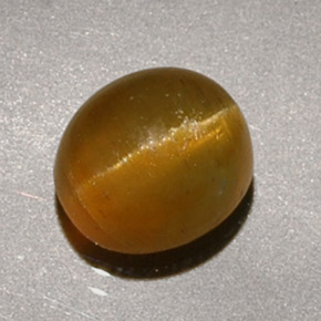 1.90 ct Yellow Cat's Eye Apatite Gemstone, Cat's Eye Apatite Gem in Oval Cabochon Shape for Sale.