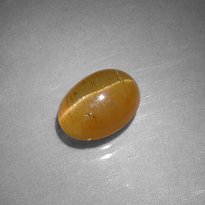 1.43 ct Orange Cat's Eye Apatite Gemstone, Cat's Eye Apatite Gem in Oval Cabochon Shape for Sale.