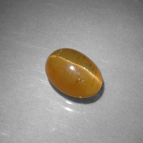 1.43 ct Orange Cat's Eye Apatite Stone, Natural Cat's Eye Apatite in Oval Cabochon Shape for Sale