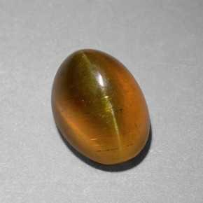6.55 ct Gold Cat's Eye Apatite Gemstone, Cat's Eye Apatite Gem in Oval Cabochon Shape for Sale.