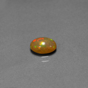0.68 ct Multicolor Chocolate Opal Gemstone, Chocolate Opal Gem in Oval Cabochon Shape for Sale.