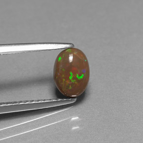 0.60 ct Multicolor Chocolate Opal Gemstone, Chocolate Opal Gem in Oval Cabochon Shape for Sale.