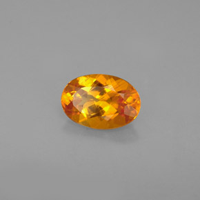 0.67 ct Orange Clinohumite Stone, Natural Clinohumite in Oval Facet Shape for Sale