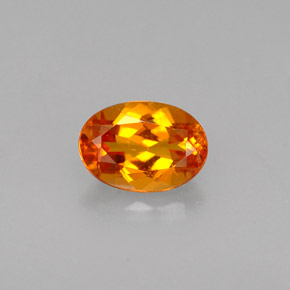 0.56 ct Orange Clinohumite Gemstone, Clinohumite Gem in Oval Facet Shape for Sale.