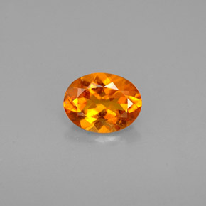 0.60 ct Orange Clinohumite Gemstone, Clinohumite Gem in Oval Facet Shape for Sale.