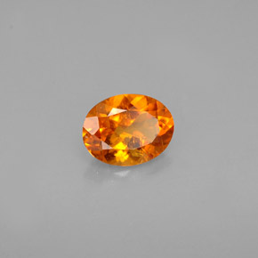 0.60 ct Orange Clinohumite Stone, Natural Clinohumite in Oval Facet Shape for Sale