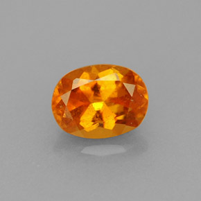 0.75 ct Orange Clinohumite Gemstone, Clinohumite Gem in Oval Facet Shape for Sale.