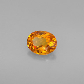 0.54 ct Orange Clinohumite Stone, Natural Clinohumite in Oval Facet Shape for Sale