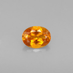 0.57 ct Orange Clinohumite Gemstone, Clinohumite Gem in Oval Facet Shape for Sale.