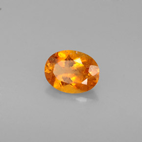 0.57 ct Orange Clinohumite Stone, Natural Clinohumite in Oval Facet Shape for Sale