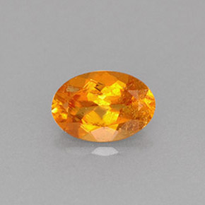 0.61 ct Orange Clinohumite Gemstone, Clinohumite Gem in Oval Facet Shape for Sale.