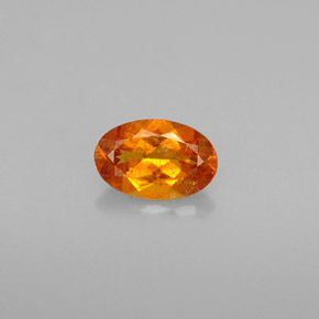 0.54 ct Orange Clinohumite Gemstone, Clinohumite Gem in Oval Facet Shape for Sale.