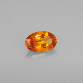 0.54 ct Orange Clinohumite Stone, Natural Clinohumite in Oval Facet Shape for Sale