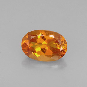 0.60 ct Orange Clinohumite Gemstone, Clinohumite Gem in Oval Facet Shape for Sale.