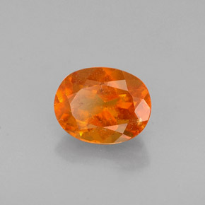 0.72 ct Orange Clinohumite Stone, Natural Clinohumite in Oval Facet Shape for Sale