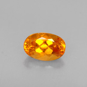 0.47 ct Orange Clinohumite Gemstone, Clinohumite Gem in Oval Facet Shape for Sale.