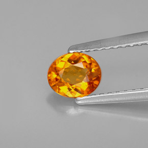 0.54 ct Orange Clinohumite Stone, Natural Clinohumite in Oval Facet Shape for Sale