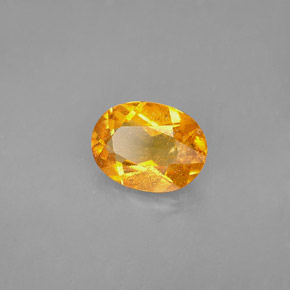 1.68 ct Orange Clinohumite Stone, Natural Clinohumite in Oval Facet Shape for Sale
