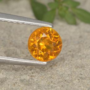 0.6ct Round Facet Yellow Orange Clinohumite for sale thumb image of 0.6ct Round Facet Yellow Orange Clinohumite (ID: 495205)