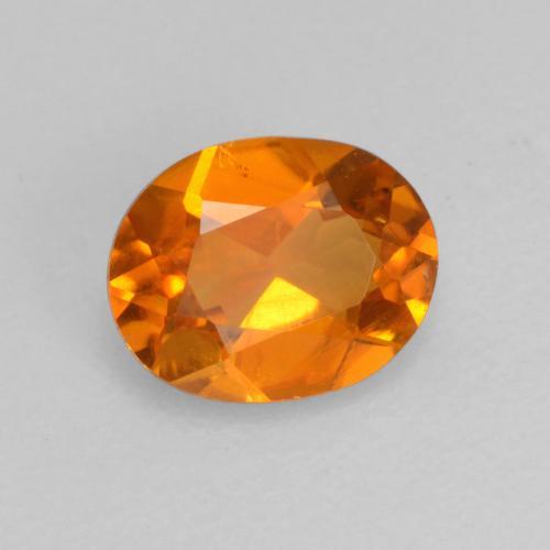 0.52 ct Orange Clinohumite Stone, Natural Clinohumite in Oval Facet Shape for Sale